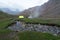 Bonfire and Camping Tent in Chitkul Trek - Landscape of Sangla Valley, Himachal Pradesh, India / Kinnaur Valley