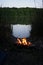 Bonfire at lake campsite  at dusk