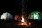 Bonfire near camping tents outdoors
