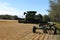 BONNYVILLE, ALBERTA, CANADA - SEPTEMBER 12, 2020: Back view of a John Deere combine and equipement in a local barley