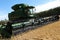 BONNYVILLE, ALBERTA, CANADA - SEPTEMBER 12, 2020: Diagonal photo of a empty John Deere combine in a local framers' barley