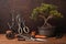bonsai tree pruning tools and wire on a wooden surface
