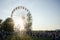 Bontida, Romania - JULY 21 2018: Crowd  and the ferris wheel in the sunset at Electric Castle Festival, Bontida, Romania