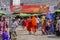 Bonzes walking in Burmese market , Myanmar