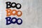 Boo word for Halloween three times, centered, isolated on marble