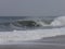 Boogieboarder on a Winter noreaster waves at indian river inlet