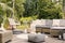 Book on a black and white pouf in the middle of a bright terrace