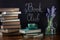 Book Club Concept. A stack of books and coffee on a desk with chalk lettering