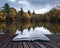 Book concept Beautiful vibrant Autumn woodland reflecions in cal