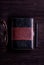 Book, eyeglasses and pen laid on old wooden table