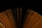 Book fanned pages in dark room