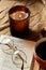 book, glasses, coffee and candle on warm blanket