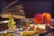 Book, glasses, fruits and autumn leaves on a wooden table.