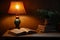 Book beside lamp cozy ambiance, perfect for evening reading