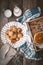 Book, lavender, oatmeal cookies and a cup of milk on old boards