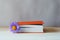 Book with pretty purple wildflower bookmark on wooden table