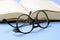 Book and reading glasses