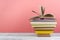 Book stacking. Open book, hardback books on wooden table and blue background. Back to school. Copy space for text