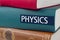 Book with the title Physics written on the spine