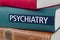 Book with the title Psychiatry written on the spine