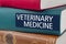 Book with the title Veterinary Medicine written on the spine