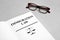 Book with words IMMIGRATION LAW and glasses