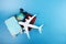 Booking hotels and air tickets for travel, online tours, summer holidays and vacations, plane and luggage on a blue background,