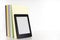 Books with blank spine and electronic reader on a white shelf, white background