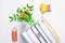 Books, bookmark glasses, gingerbread pencil and yellow bell, chrysanthemum on a white wooden background