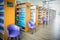 The books on bookshelf and purple chairs in interior library of University