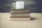 Books with coffe cup on retro background with Instagram Style F