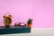 Books and glasses on a white wooden table are clocks and decorations