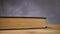 Books on an old wooden table.