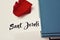 Books, red rose and text Sant Jordi