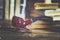 Books and a smoking pipe on a wooden table. Beautiful stylish composition. Toning in the style of vintage. Closeup, soft focus