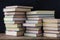 Books in stacks in the background of a school blackboard.