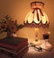 Books, wine, flowers, a discreet light lamp, glasses.  Quiet evening at home