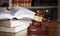 Books and wooden gavel on wooden table