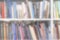 Bookshelf with books. Blurred, defocused