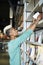 Bookstore employee putting books on shelf