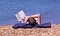 Bookworm on the beach