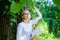 Bookworm student relaxing with book green nature background. Girl keen on book keep reading. Woman blonde take break