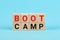 BOOT CAMP word is written on woodblock, business concept Bootcamp word abstract in wood type.