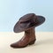 Boot shoes and texas wild west american cowboy hat as minimal concept