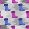 Boots against the background of stains of dirt paint. Seamless pattern.