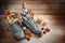 Boots filled with sweets, chocolate Santa and Christmas decoration on a wooden background with candles, tradition on German