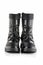 Boots for a modern grunge woman. Women\\\'s black boots with laces isolated on white. Black Leather Army Boots