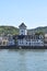 Boppard, Germany - 08 06 2020: white waterfront building with a tower and ship jetty