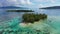 Bora Bora Drone aerial video of small Island paradise. Travel vacation icon of beach private island motu with palm trees