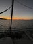 Bora Bora French Polynesia sunset from charter cruise luxury catamaran with laundry drying